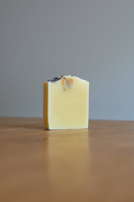 Soap on a wooden surface with a gray background