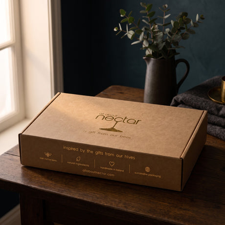 The Signature hamper, closed kraft gift box with gold foil logo